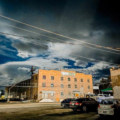 Brick block under storm clouds