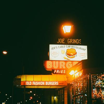 Neon burger signs at night