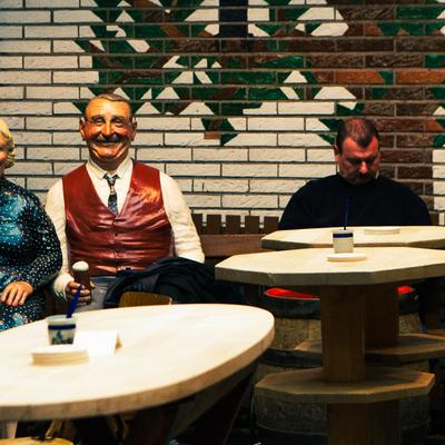 Mannequins at bar tables